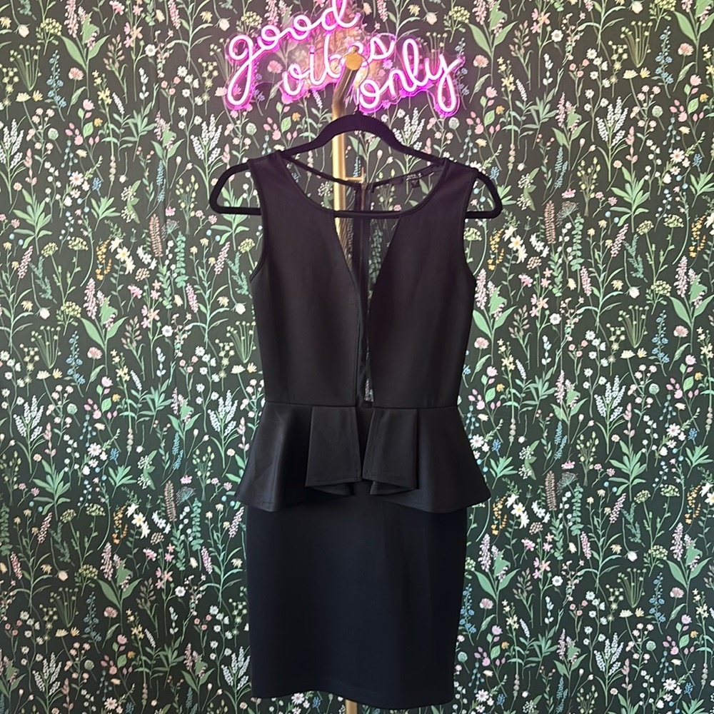 Sheer plunge neckline and all sheer back peplum dress.